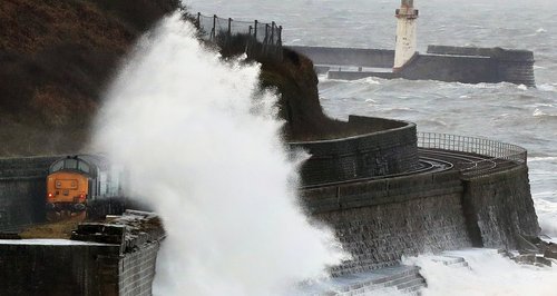 Wave crashes into wall Whitehaven in Cumbria
