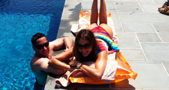 Sofia Vergara lying by a swimming pool 